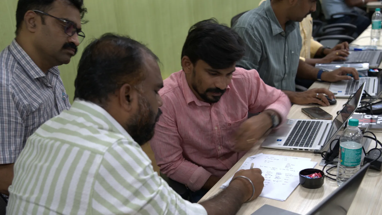 Participants working on a Lean Six Sigma Black Belt case study